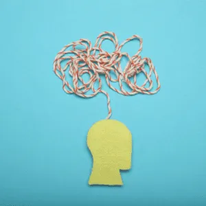 Image of a head with tangled thread to depict anxiety, scattered thoughts.