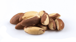 Brazil Nut on a white surface - Brazil nuts - rich in selenium for thyroid health and metabolism support.